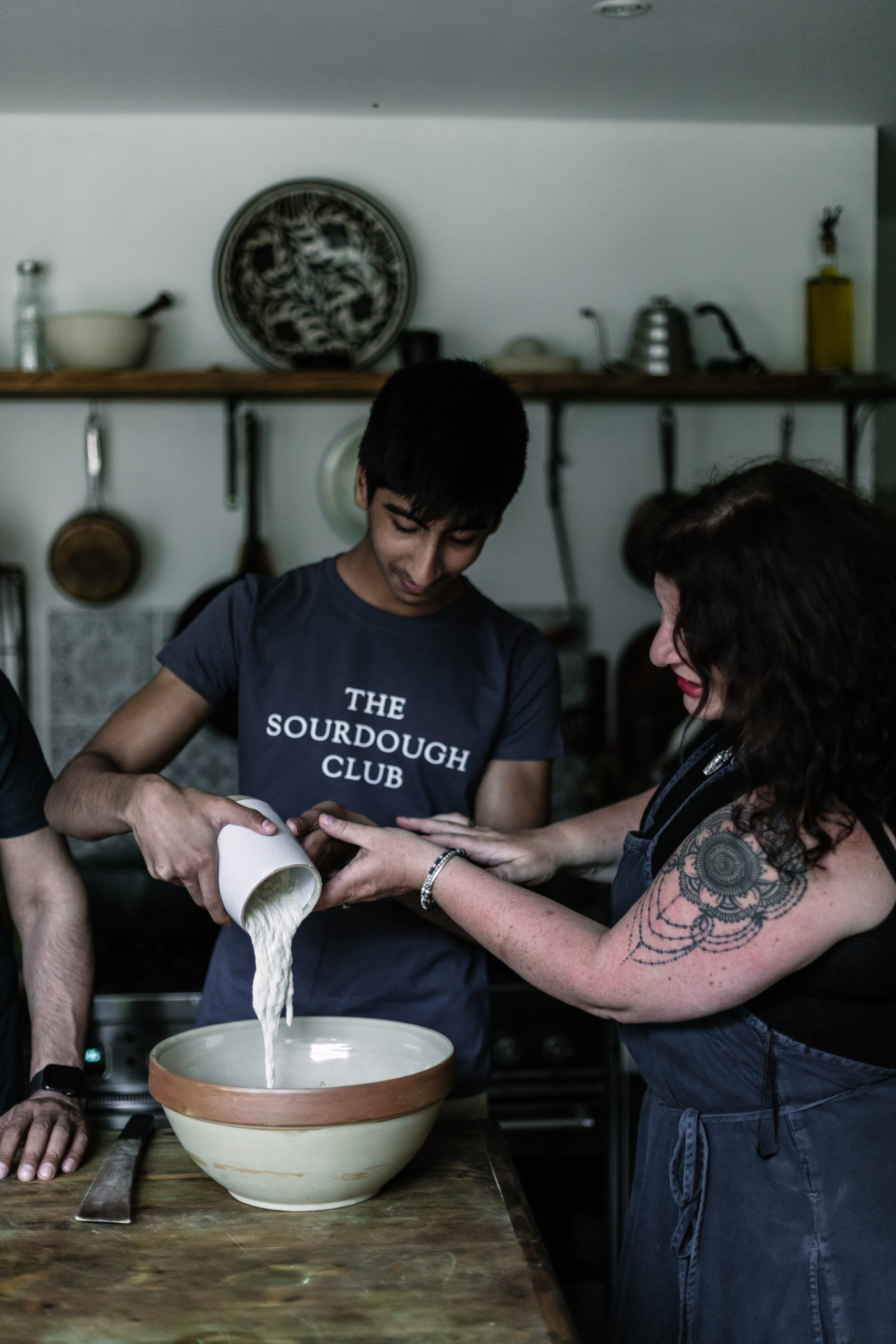 Dr Vanessa Kimbell using her sourdough starter with a student. 